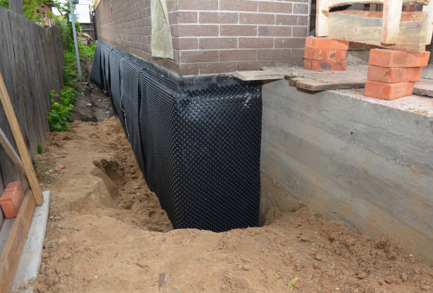 SJ Waterproofing Pros technician performing targeted Sump Pump Installation assessment in Saint Cloud, WI